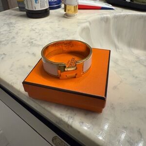 Hermès White and Gold Clic Clac Bracelet